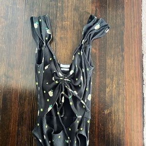black and flower patterned body suit with cut out stomach
